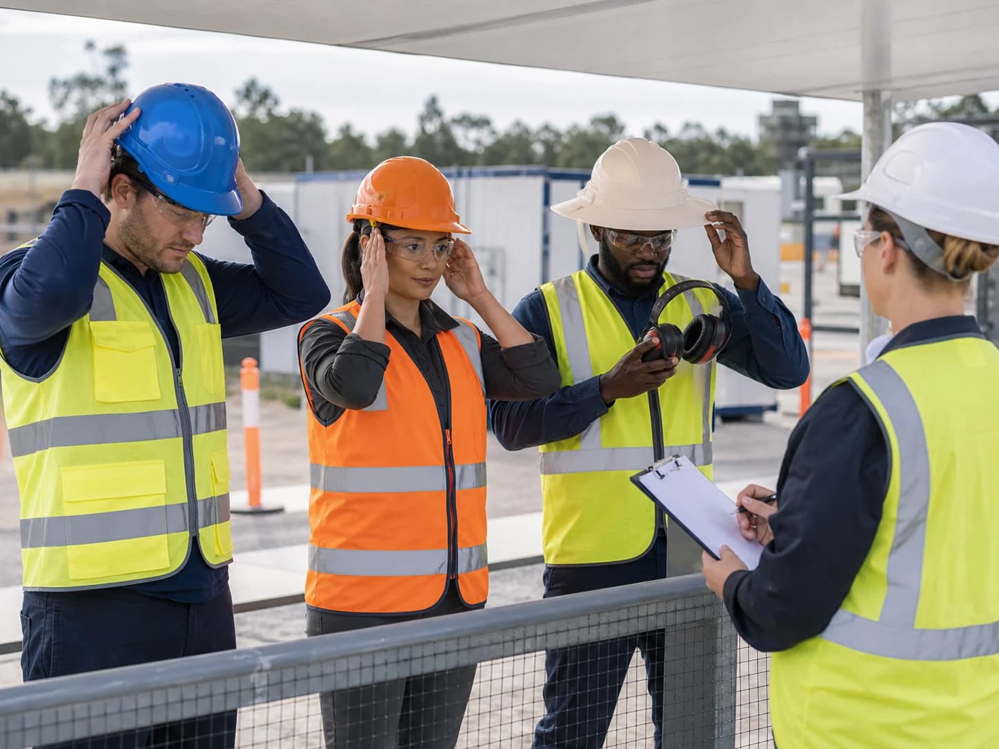 Representative workers should trial the exact shell, suspension, retention system, and compatible accessories before bulk approval.