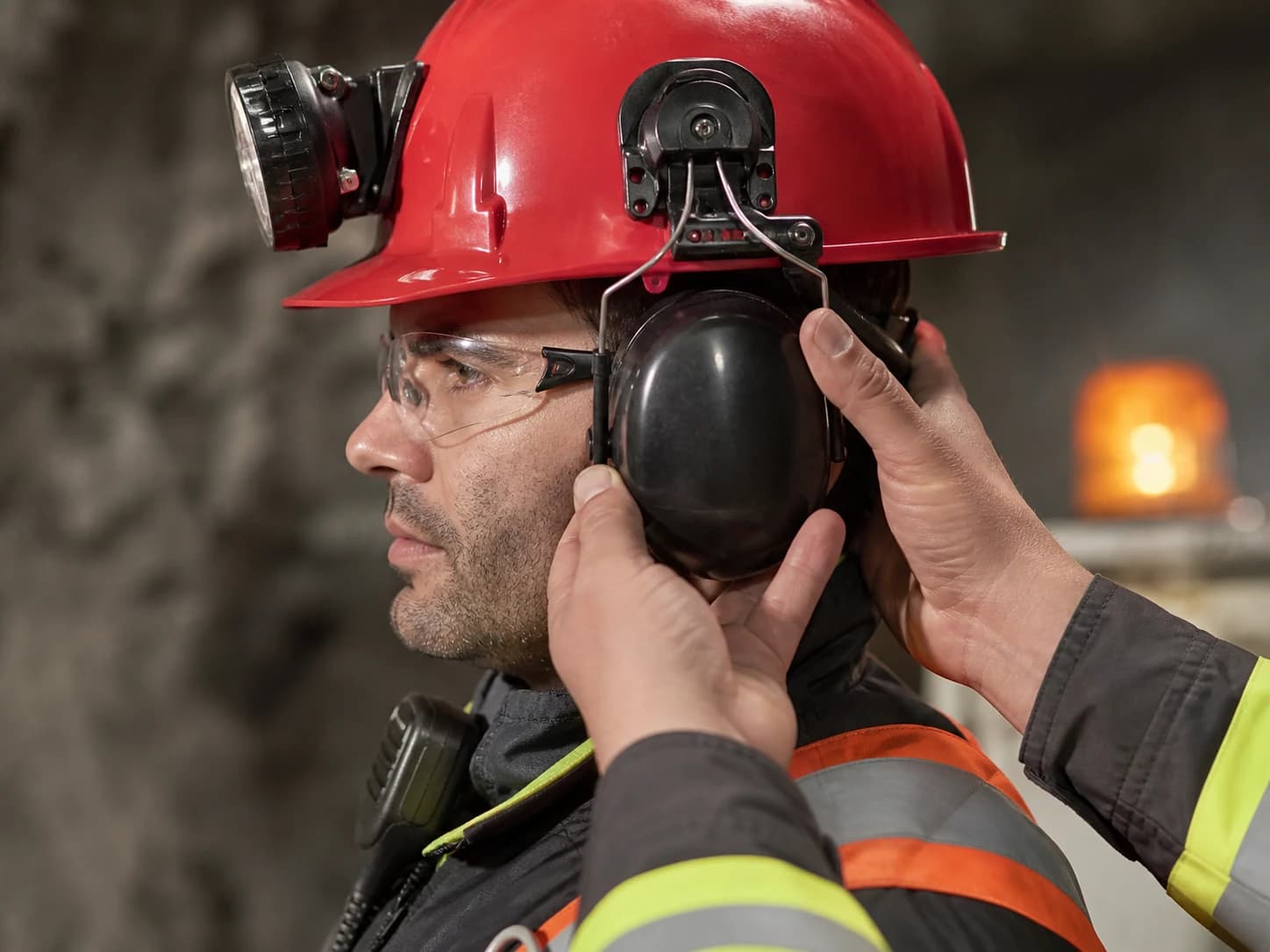The complete helmet, eyewear, respirator, hearing, lamp, and radio assembly must work without breaking fit or communication.