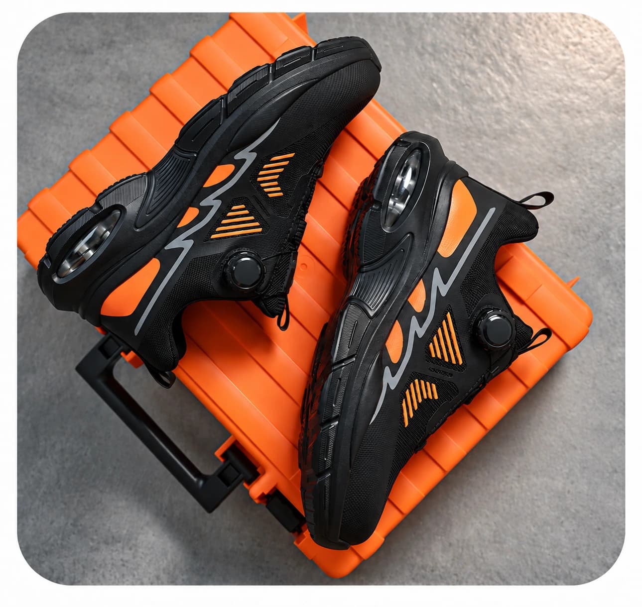 Safety shoe pair on an orange tool case