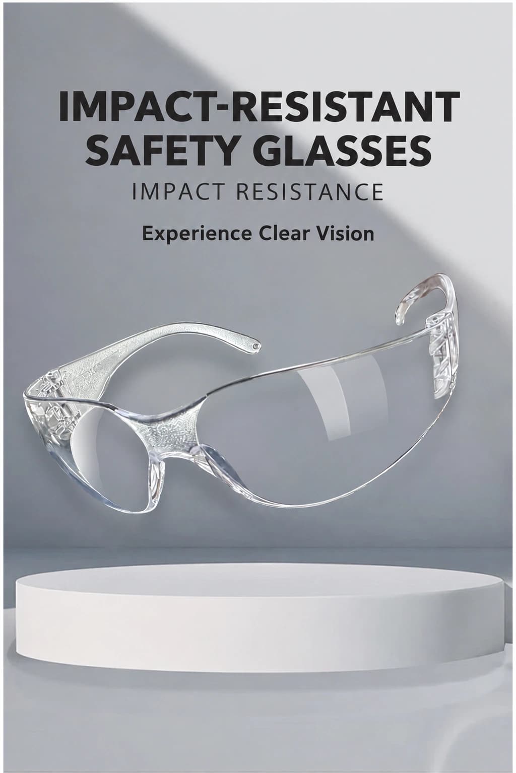 Clear impact-resistant safety glasses on a gray display stand